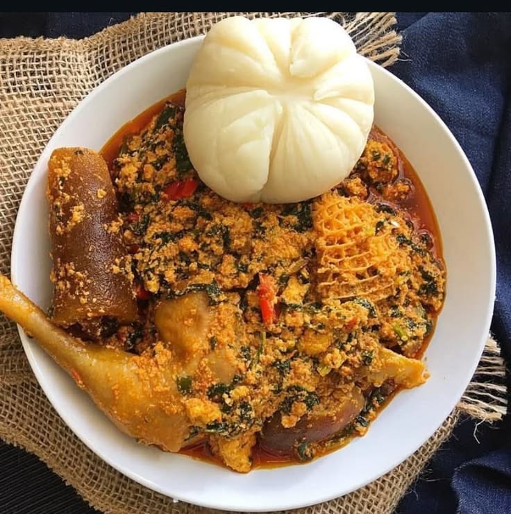 Rich Nigerian egusi soup served with assorted meat